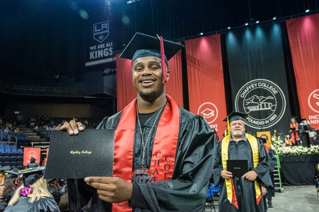 Grad student holding a diploma