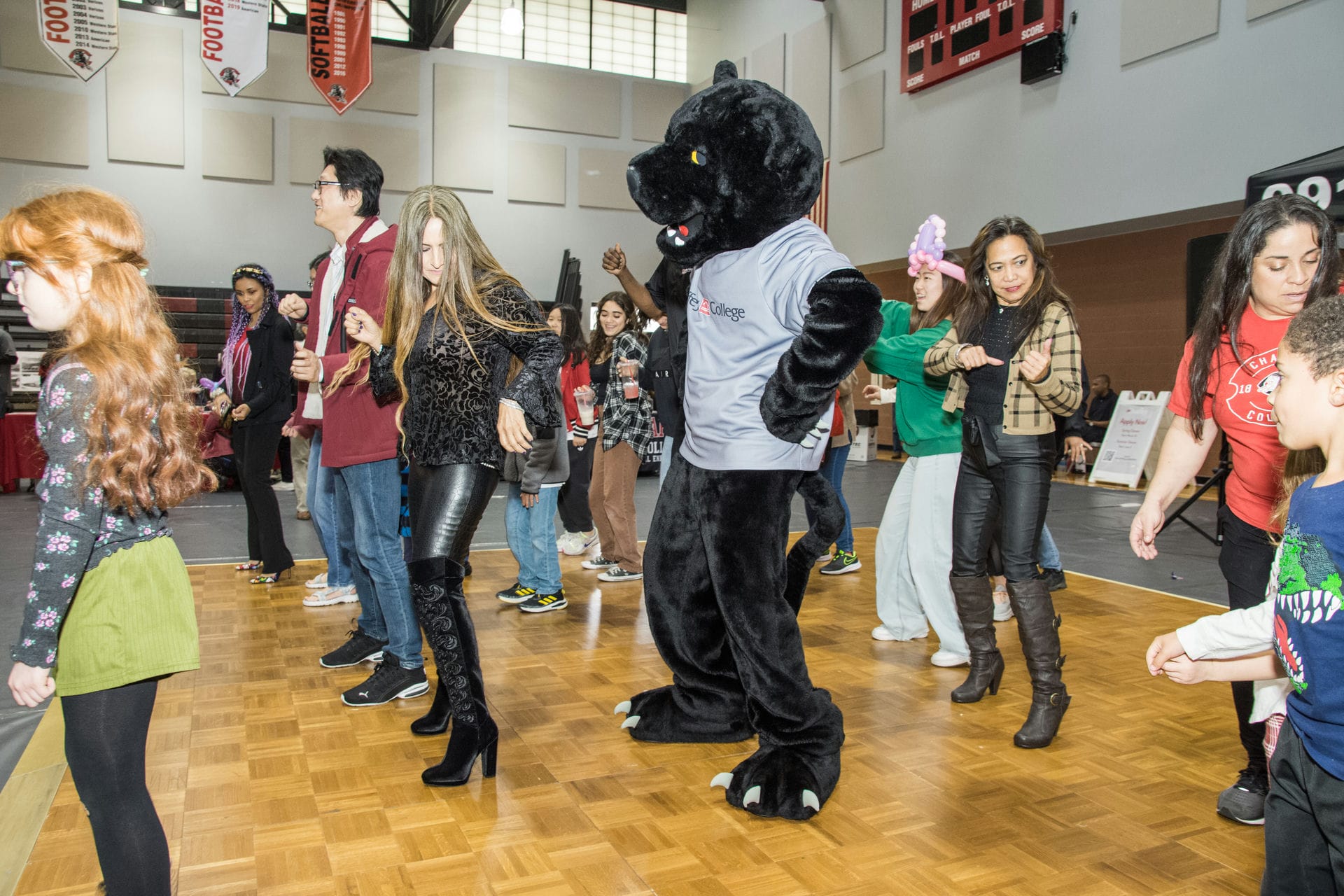 140 years celebration guests dancing with the panther mascot.