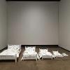 Brooke Bartholomew, “Beds (At What Moment is it Mine?),” 2024. Five beds: wood, paint, fabric, and foam. Largest bed: 40 inches long.