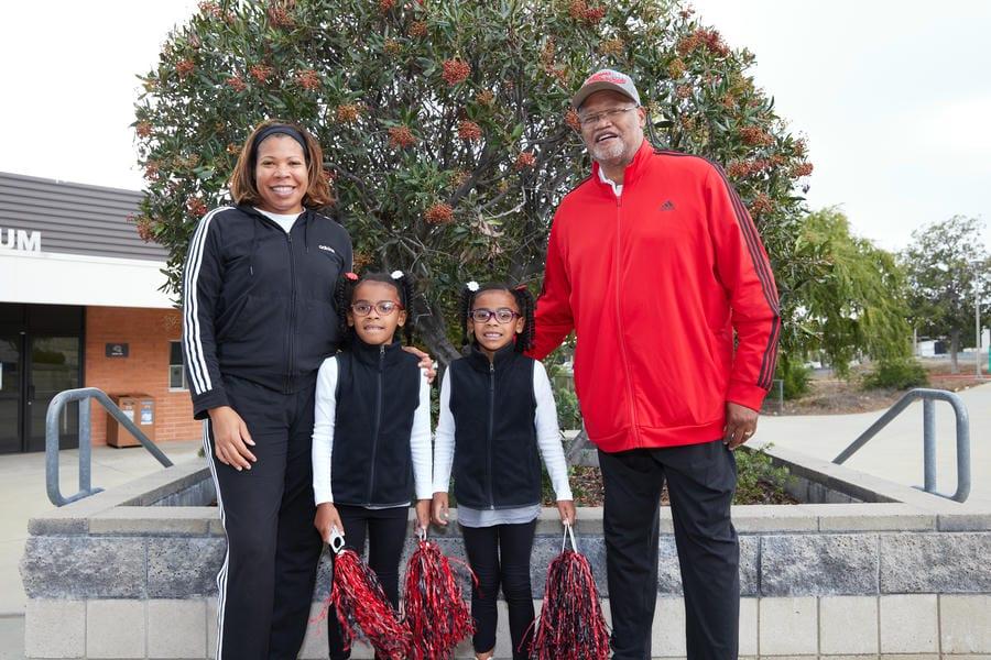 Dr. Henry Shannon smiles with 4 family members at a tailgate celebration on Chaffey College Rancho Cucamonga campus.