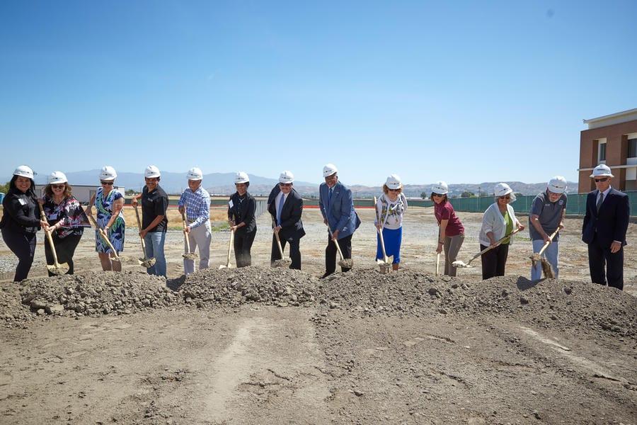 Dr. Henry Shannon and 12 college leaders hold shovels as they shovel dirt together during the groundbreaking ceremony for Chaffey College Chino Instructional Building in 2022.