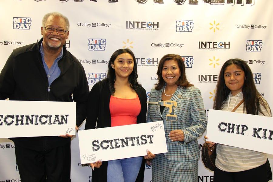 Dr. Henry Shannon, two students, and U.S. Representative Norma Torres pose together at Chaffey College InTech Center during Manufacturing Day 2018.