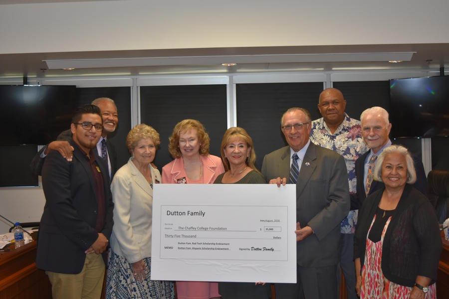 Dr. Shannon smiles with the 2018 Chaffey College Governing Board and members of the Dutton family as they present a check to the Chaffey College Foundation for the Radiologic Technology Scholarship Endowment and Hispanic Scholarship Endowment.