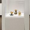 Adina Andrus, “New Lares #3: Nerio,” 2024; “New Lares #7: Gratiae,” 2024; “New Lares #8: Antevorta,” 2024. Glazed ceramic, luster, bioplastic, and 24k gold leaf. 3 inches tall.