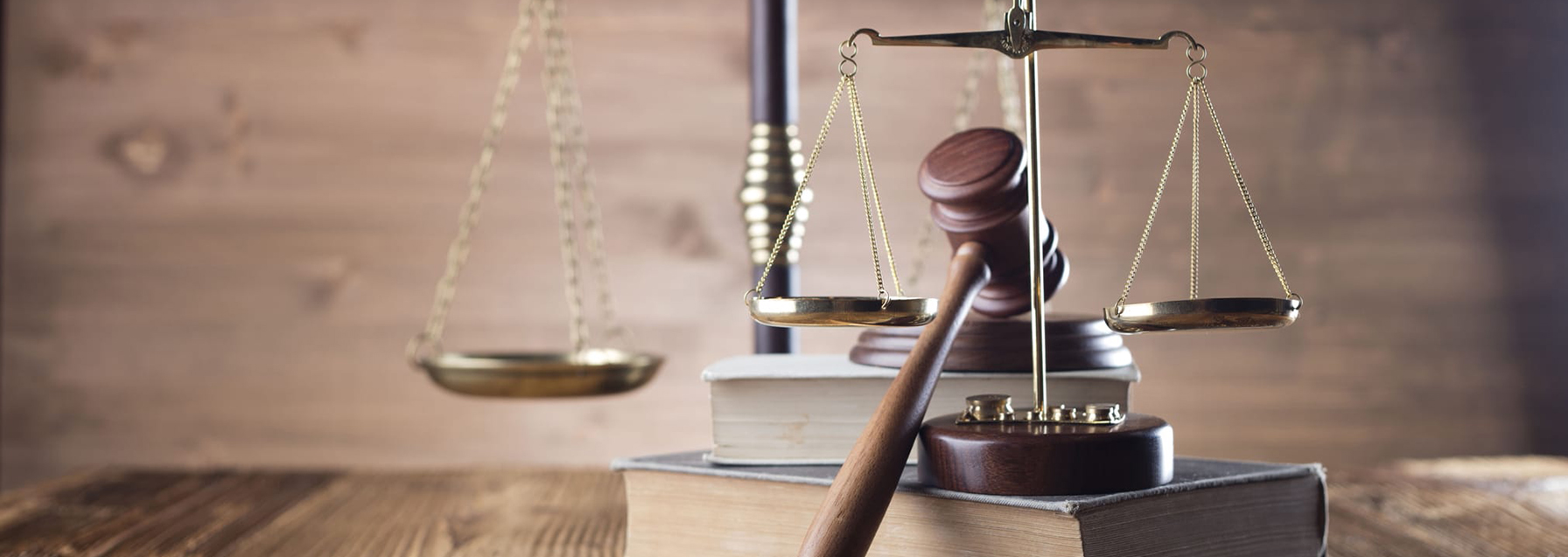 The Brass scales and the judge's hammer on the table on top of books