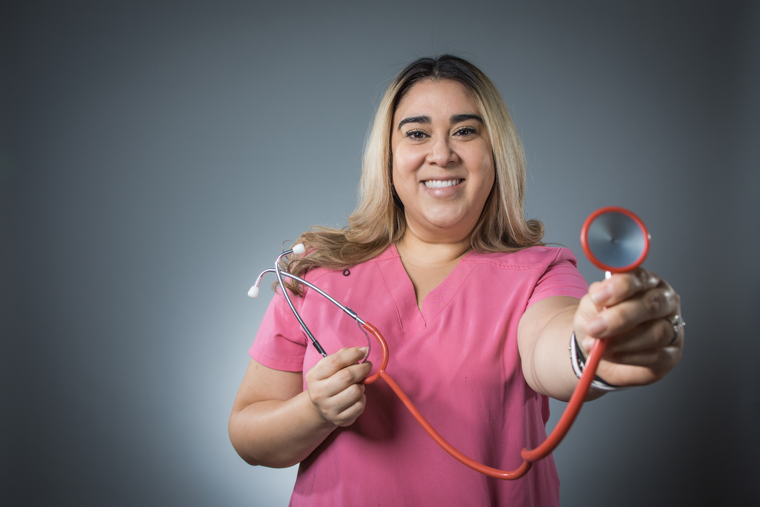 ADN student holding a stethoscope