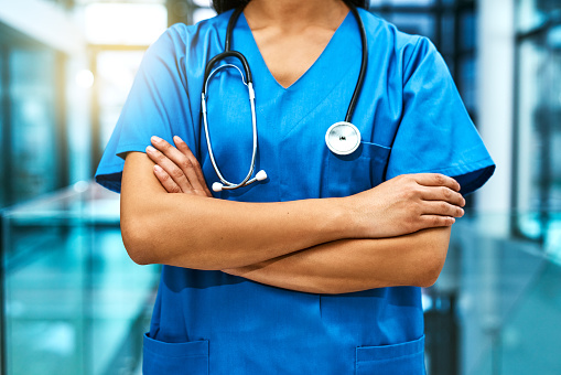  unrecognisable nurse standing in a hospital