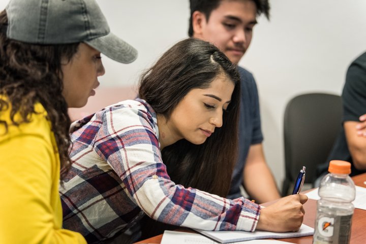 Students attend a class lecture.