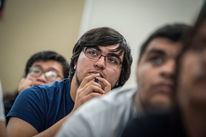 Students attend a class lecture.