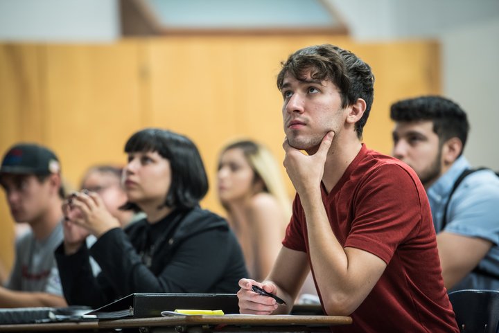 Students attend a class lecture.