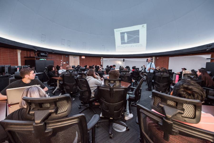 Students attend an astronony class.