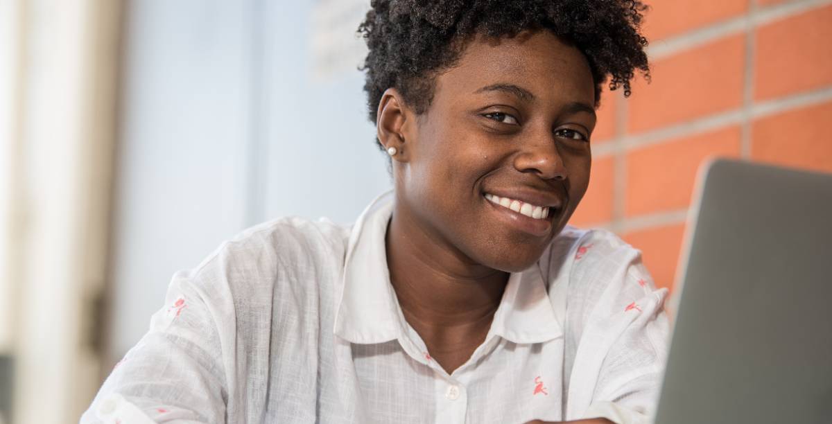 A student works on a laptop.