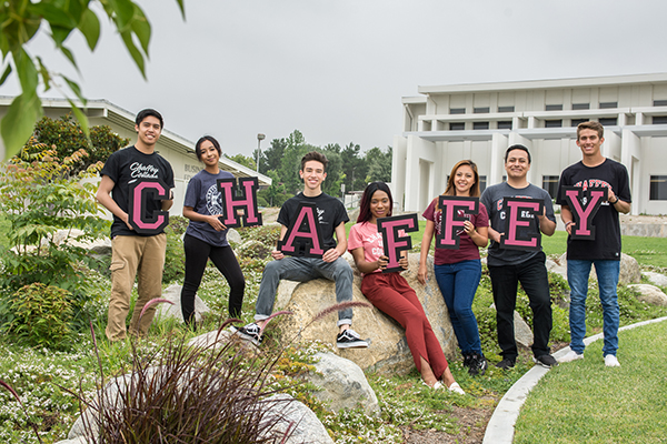 Students holding up chaffey letters