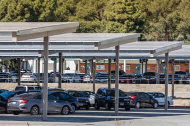 Cars parked under solar panels struture