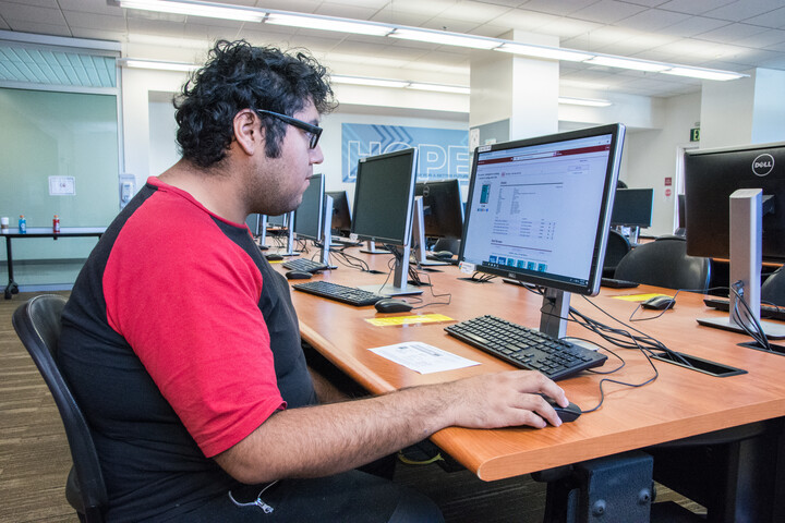 Student using a computer in the library
