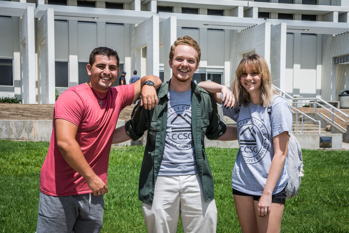 Students standing in front of the library