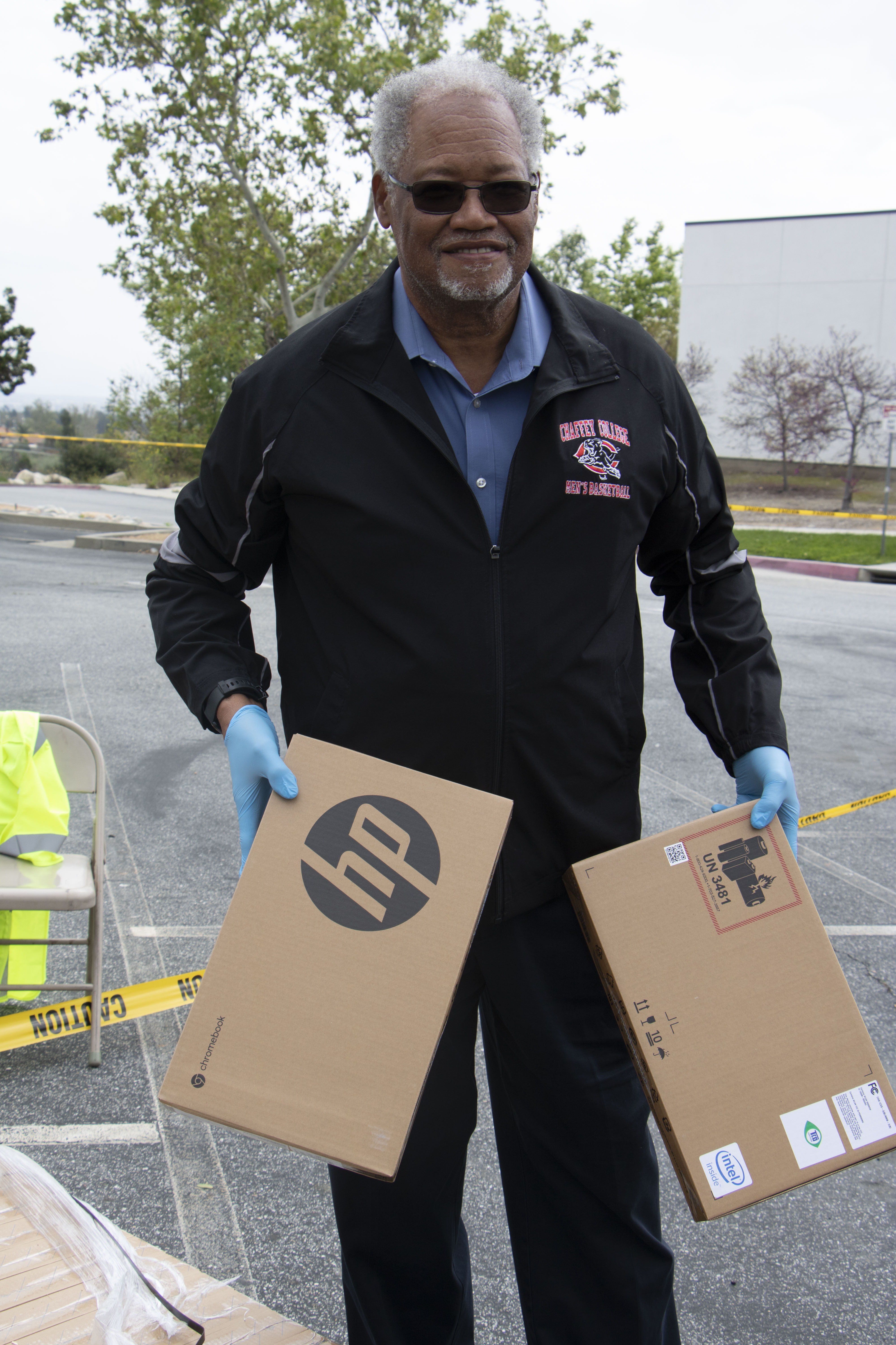 Henry D. Shannon distributes Chromebooks during the pandemic