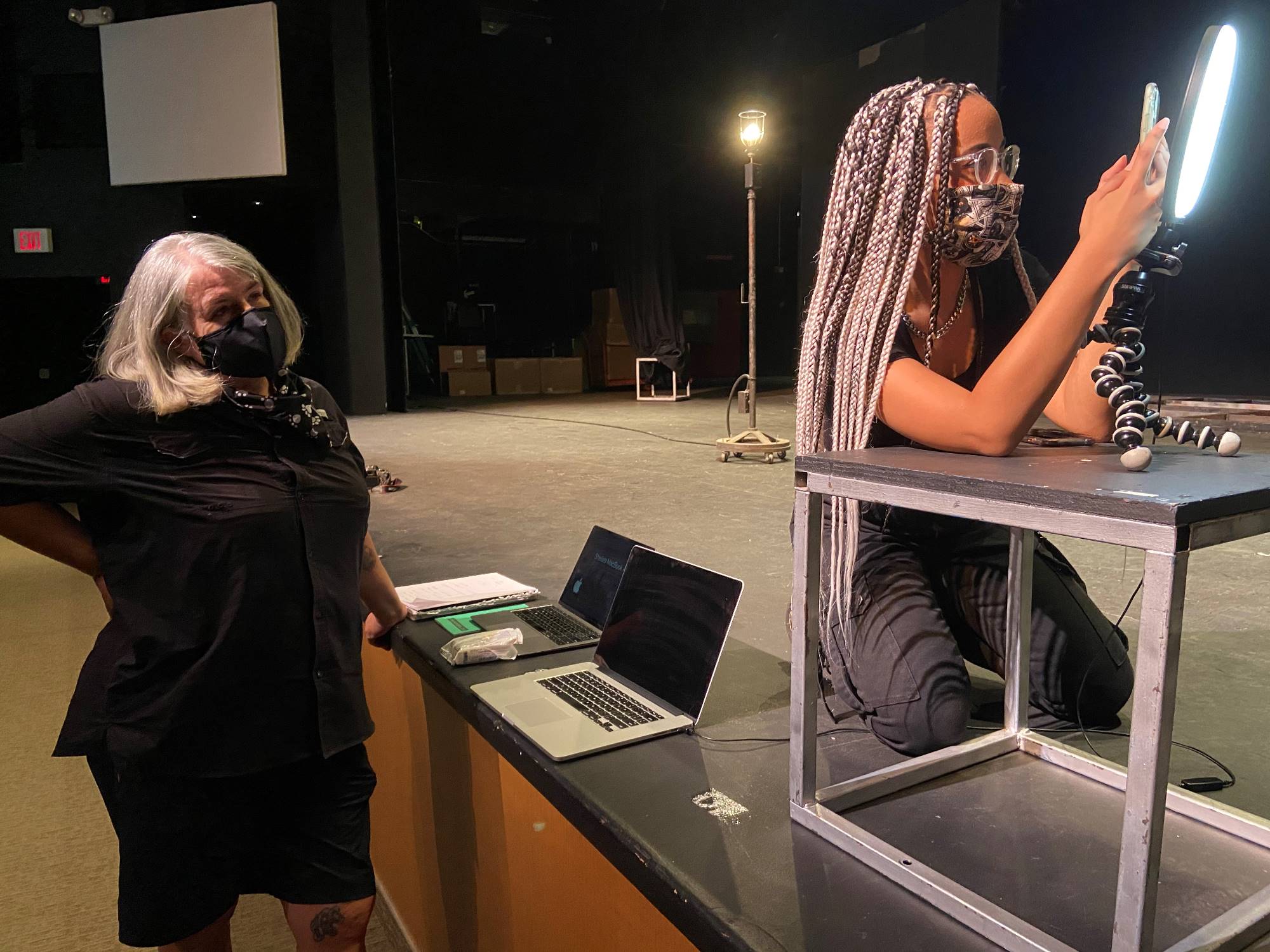 Sheila Malone works with theater graduate Mikayla Brown.