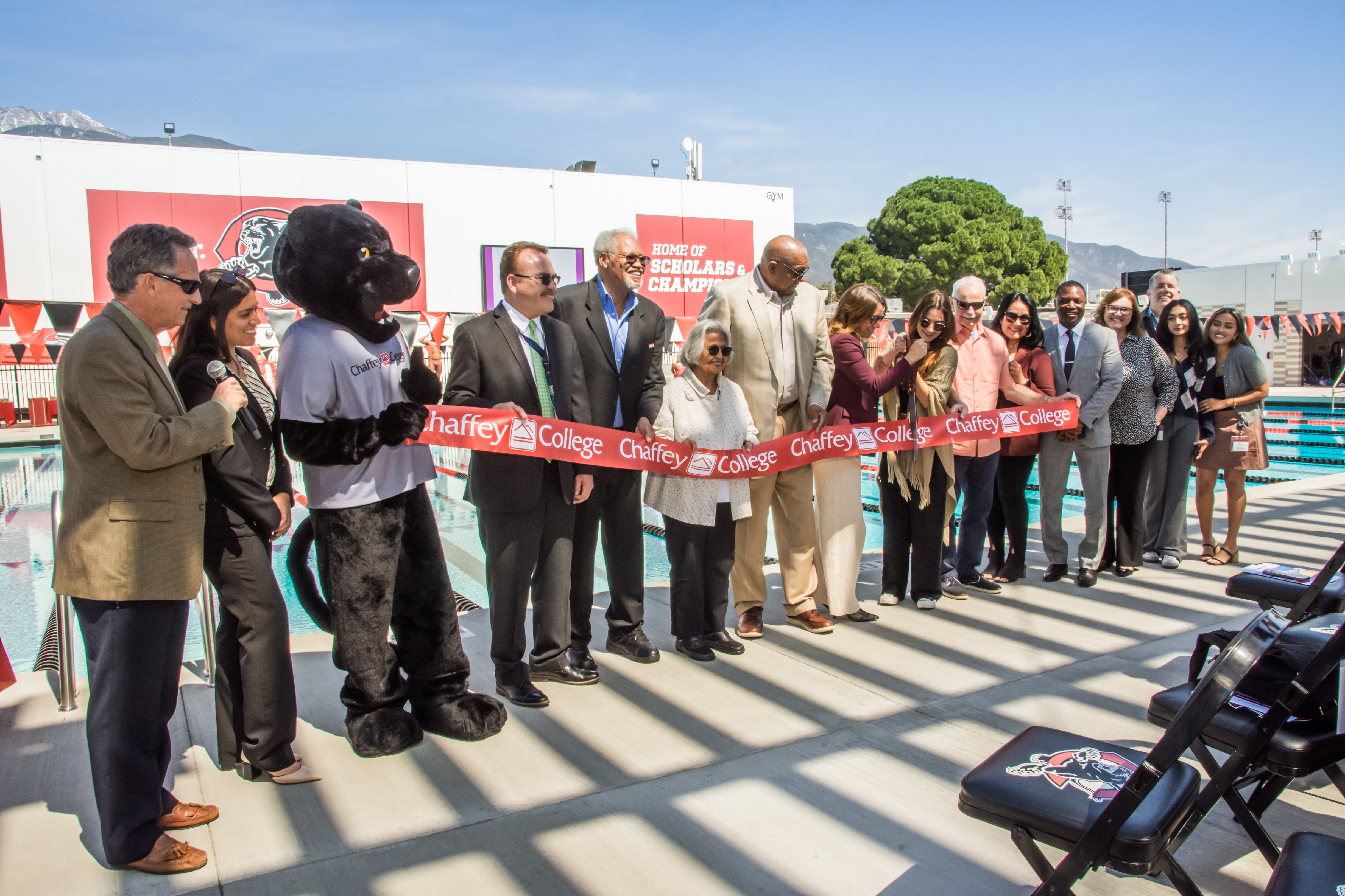 Dignitaries cut the ribbon at the Aquatic Center reopening
