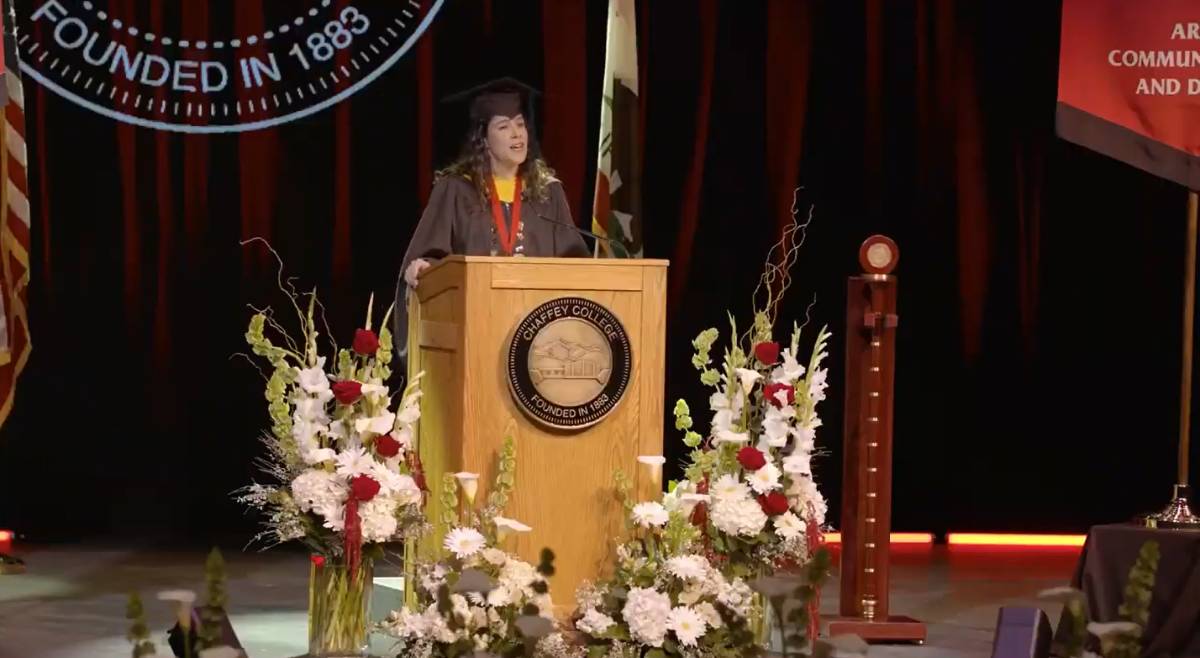 A faculty member speaks at commencement
