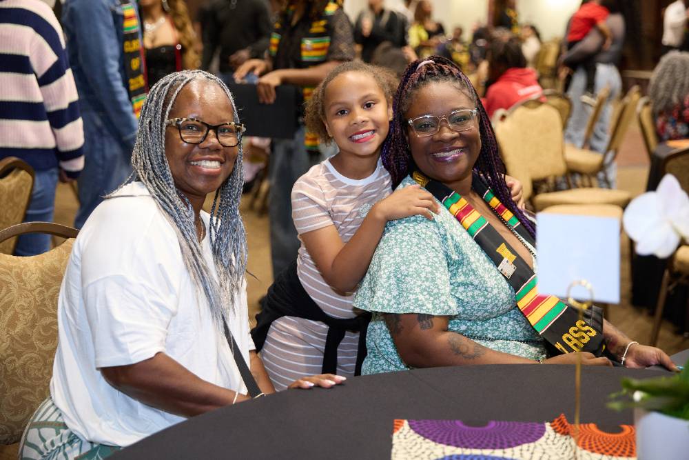 A family celebrates at the Rites of Passage ceremony at Chaffey College.
