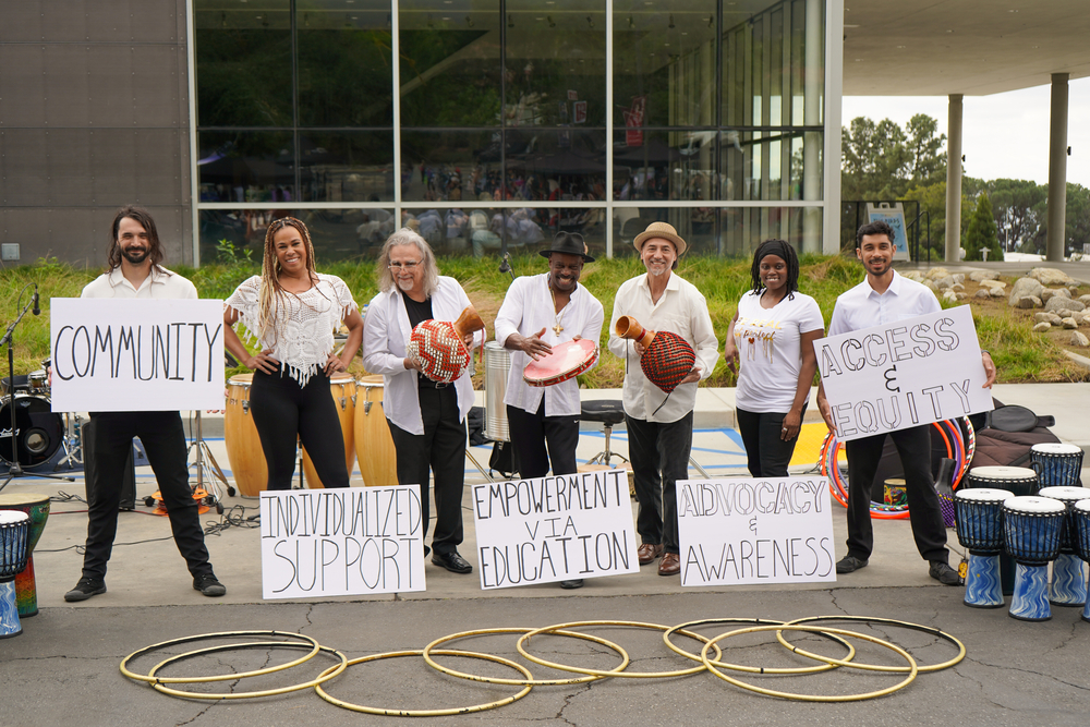 Members of the dance group Burning Desire pose with message of empowerment and inclusion during the Disability Awareness Fair.