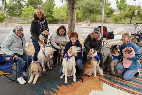 Disability Awareness Members of Paws to Share pose with their dogs at the Disability Awareness Fair at Chaffey College.