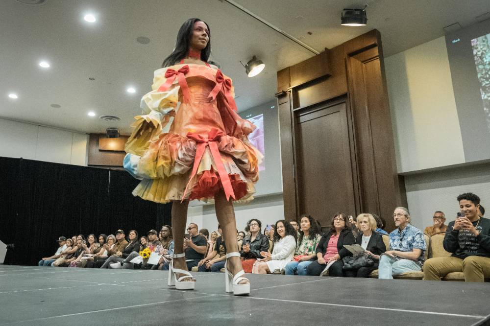 A model displays the creation of a fashion design student in the Chaffey College Fashion Show.