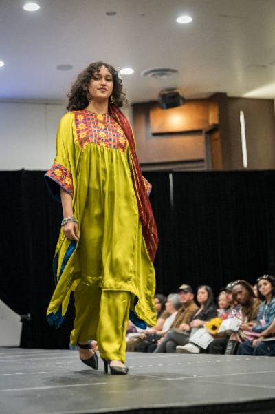 A model displays the creation of a fashion design student.