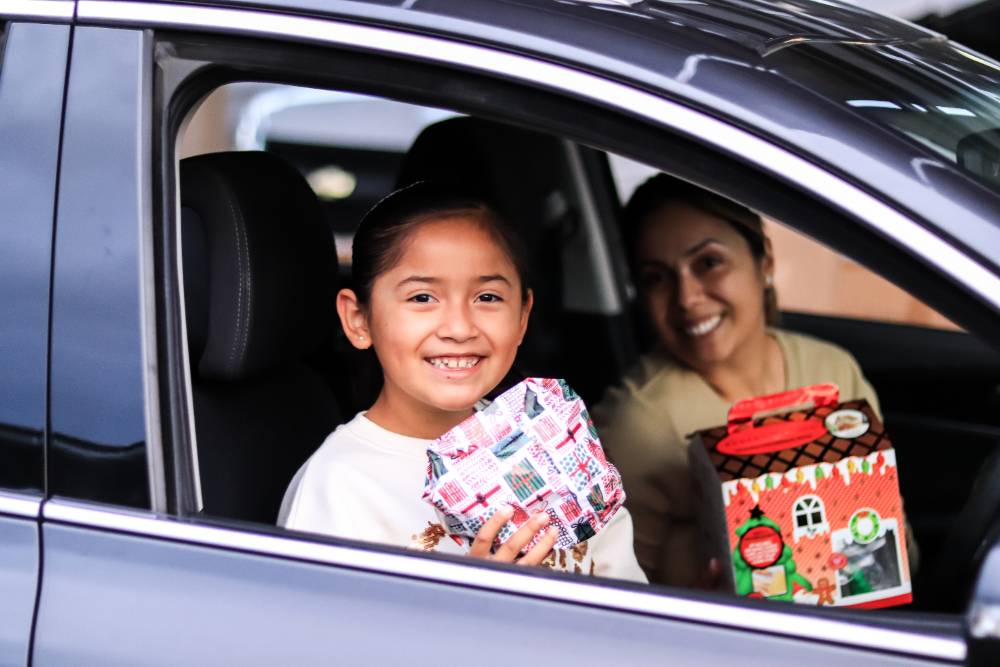 A child receives a gift at Chaffey College