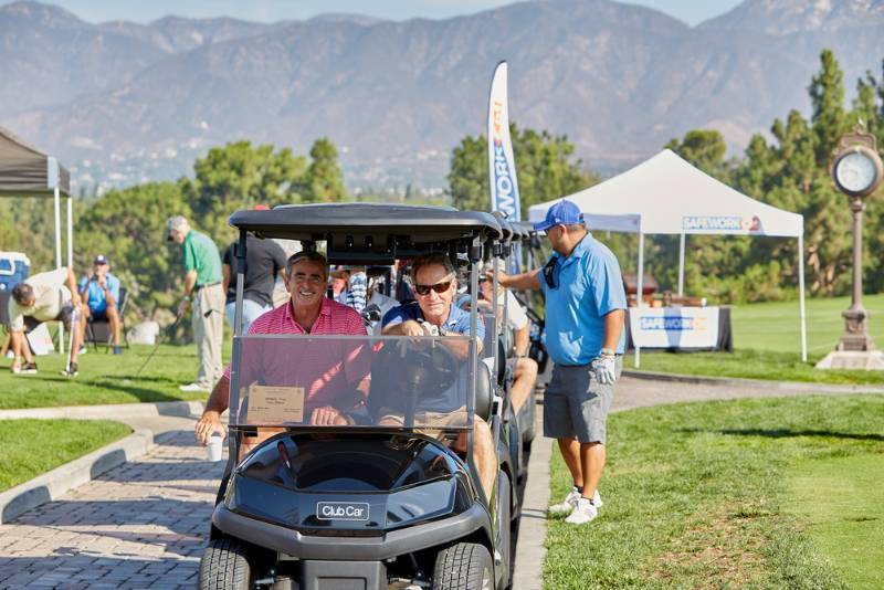 Golf tournament players line up to play