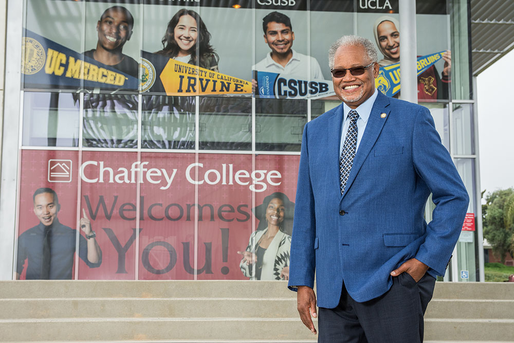 Henry Shannon stands in front of the student services and administration building.