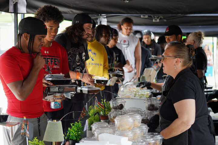 Students at Juneteenth Celebration line up for food