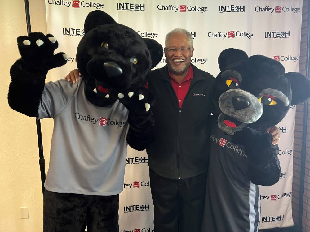 Dr. Henry Shannon poses with the Chaffey College mascots.