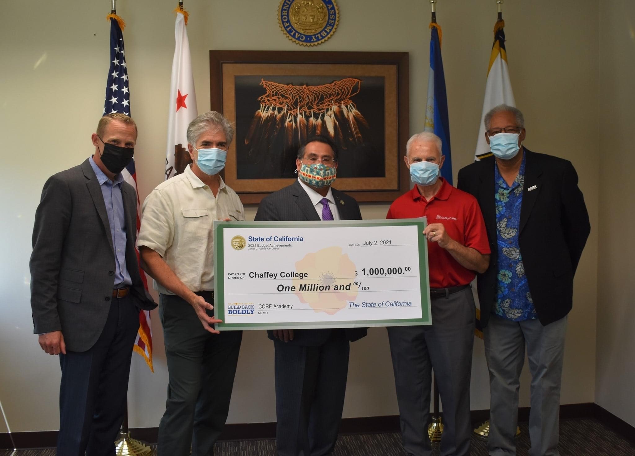 Dignitaries pose with check for National CORE/Chaffey training program.