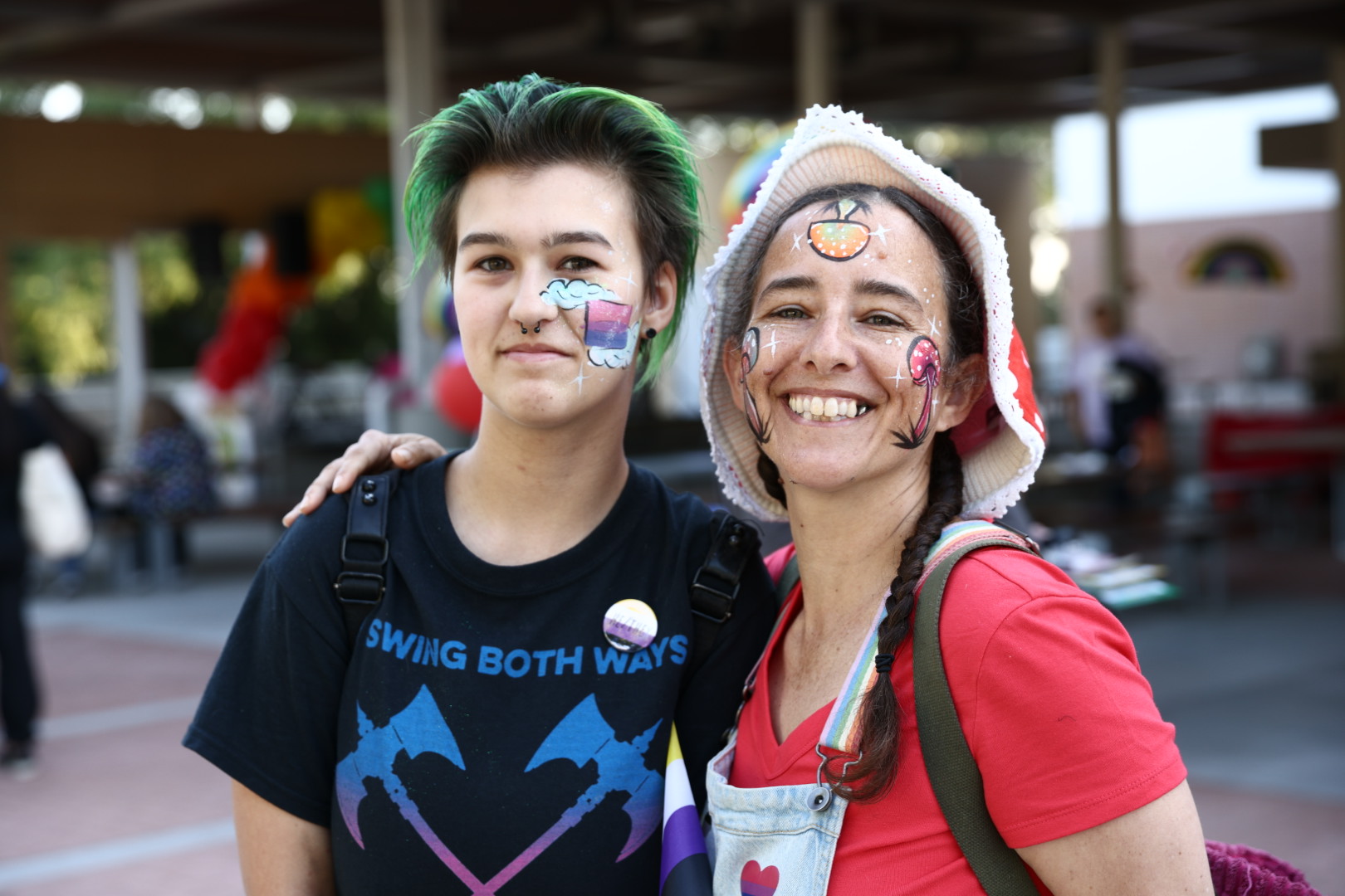 Attendees at Chaffey's Pride Celebration smile for a photo.