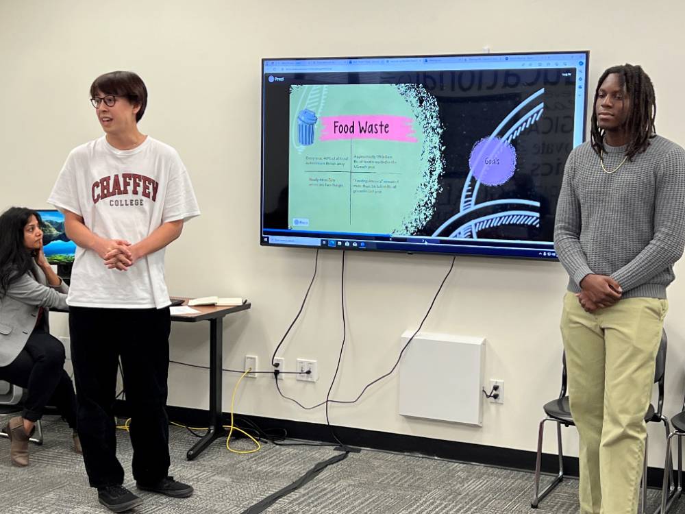 Students give a presentation at the SolveCC competition