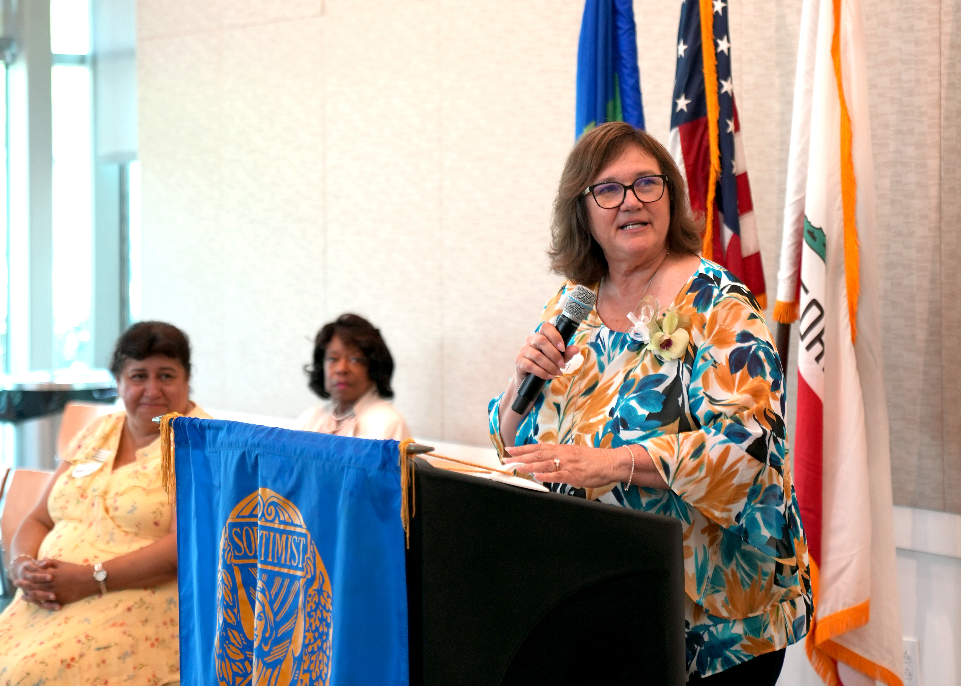 Lisa Bailey gives an acceptance speech at a Soroptimist International awards ceremony.