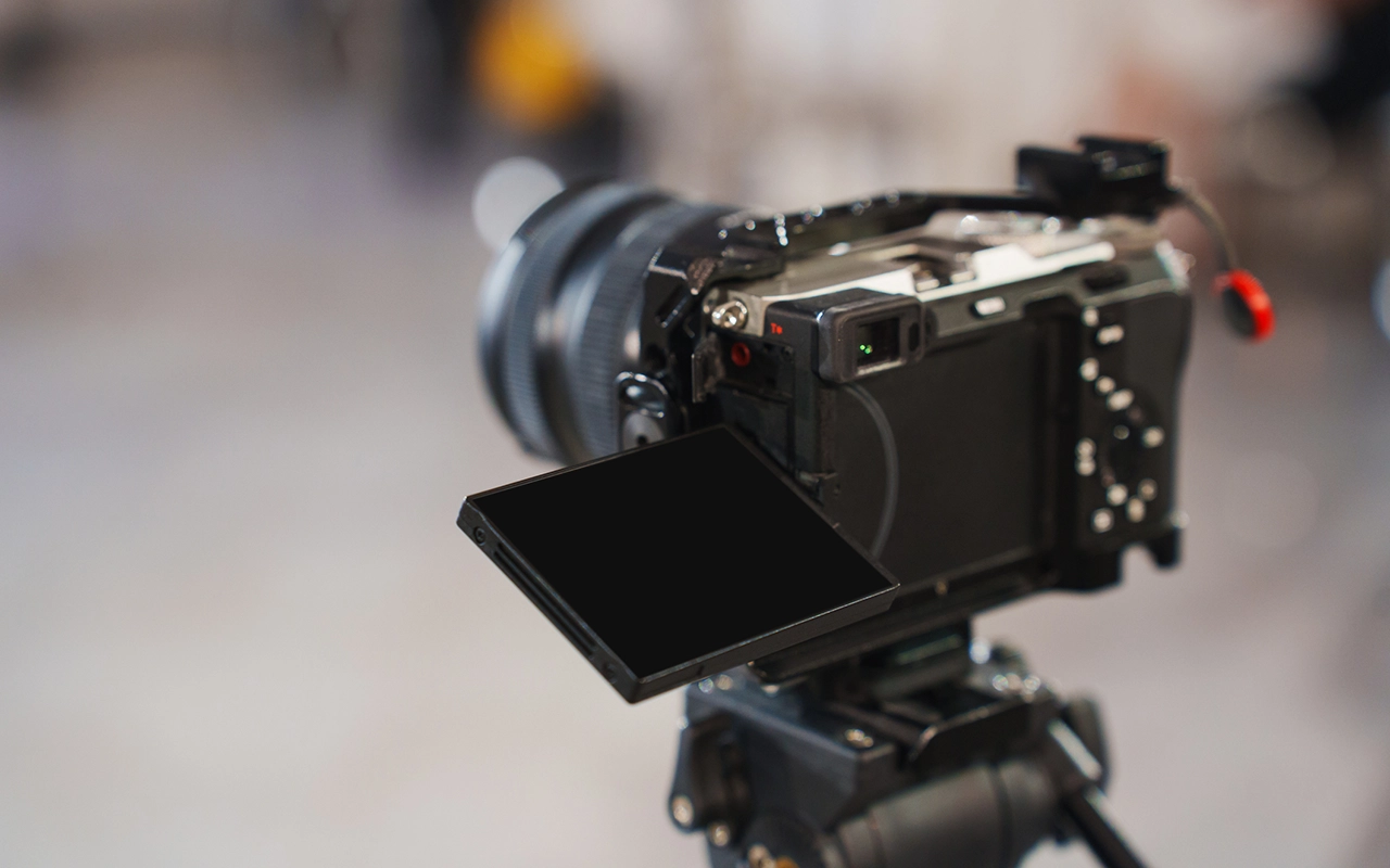 A professional camera is mounted on a tripod