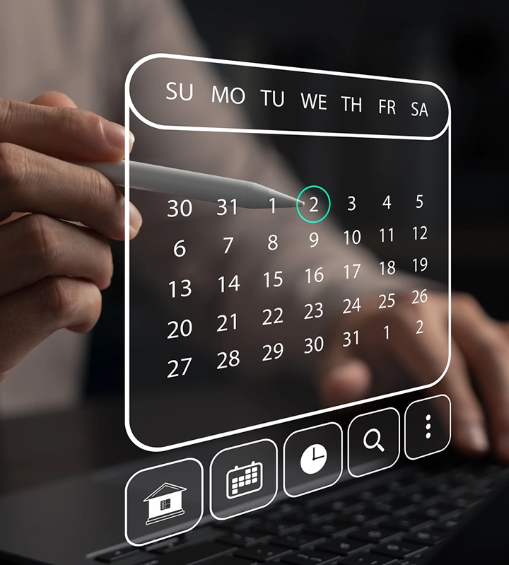Hands pointing a digital stylus at a transparent transparent calendar User Interface on a computer screen