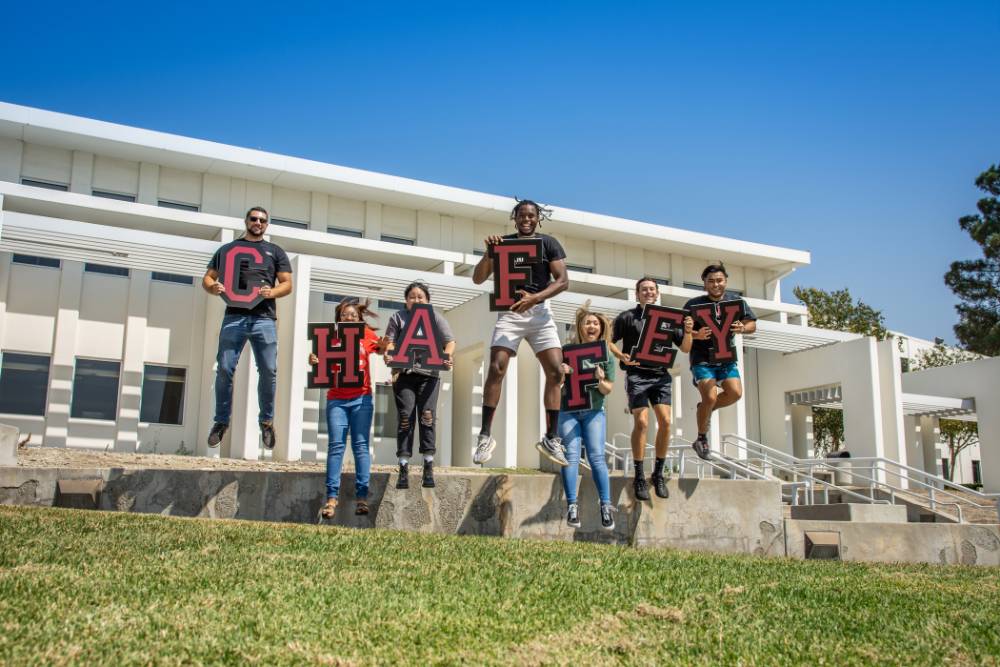 students holding letters that spell Chaffey