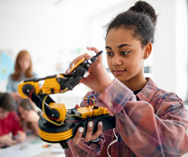 Automation, Robotics & Mechatronics student holding tools